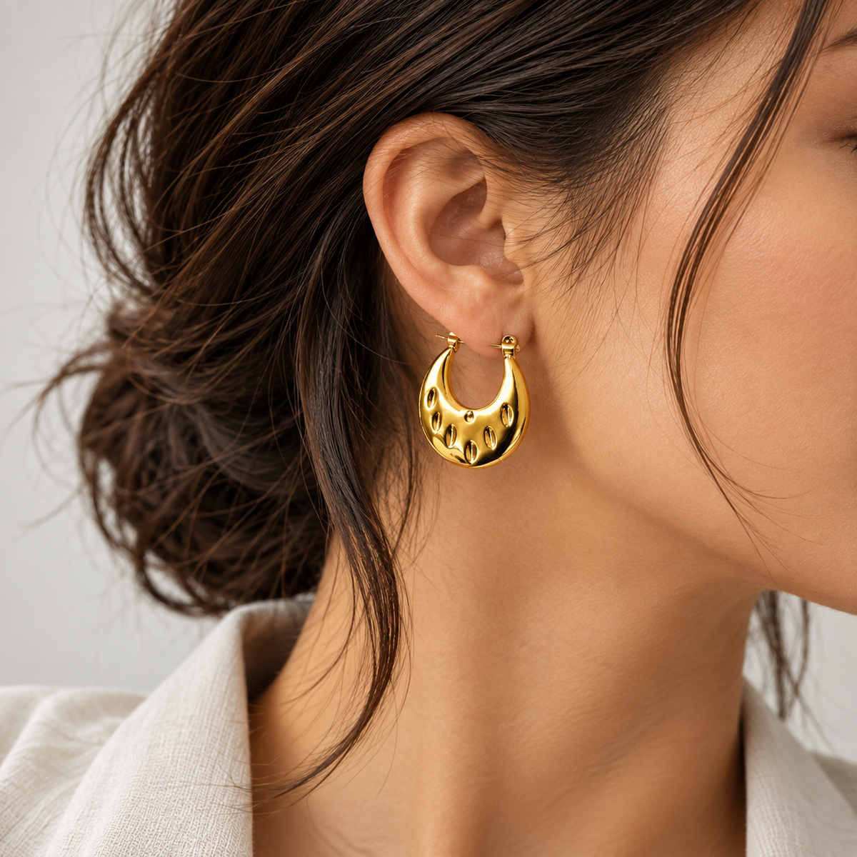 Golden Sculpted Teardrop Hoops
